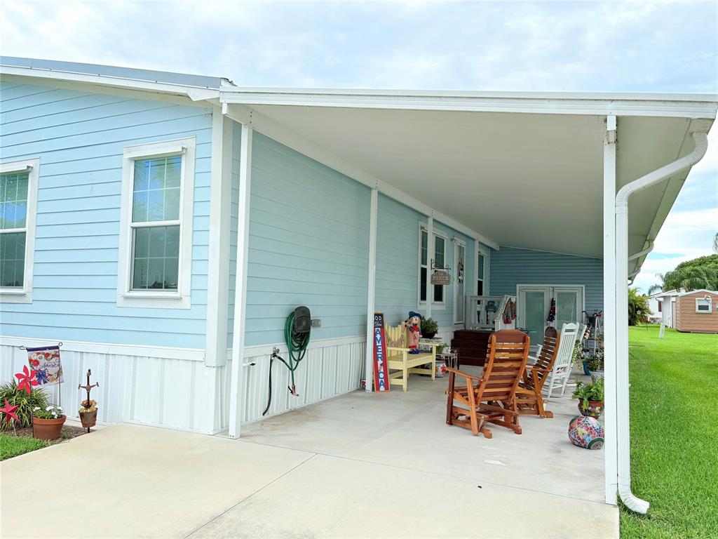 4331 Southwest 10th Way Okeechobee, FL 34974 - Photo 38 of 49 a backyard of a house with outdoor seating