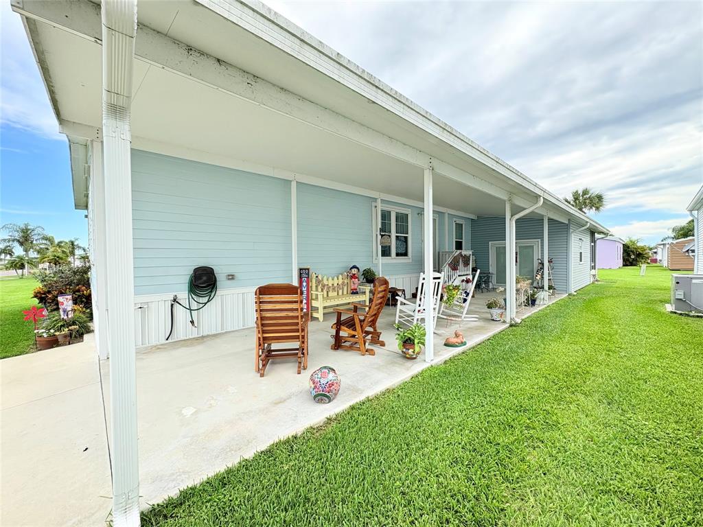 4331 Southwest 10th Way Okeechobee, FL 34974 - Photo 39 of 49 a front view of a house with garden and patio