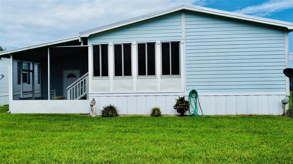 4331 Southwest 10th Way Okeechobee, FL 34974 - Photo 44 of 49 a view of house with backyard and garden