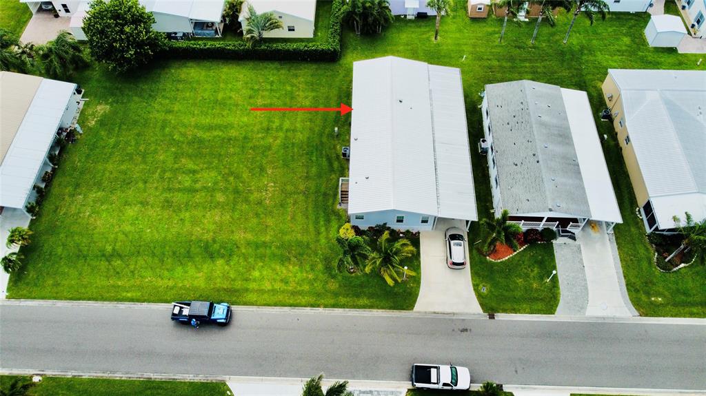 4331 Southwest 10th Way Okeechobee, FL 34974 - Photo 47 of 49 an aerial view of a house with a garden and yard