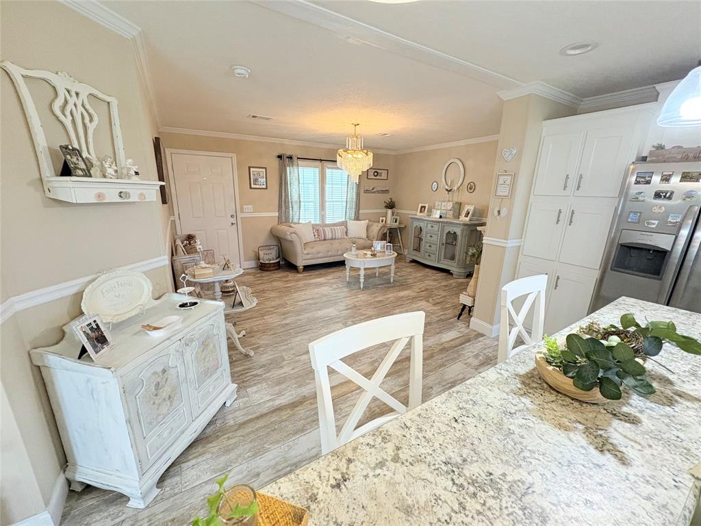 4331 Southwest 10th Way Okeechobee, FL 34974 - Photo 7 of 49 a living room with furniture and a flat screen tv