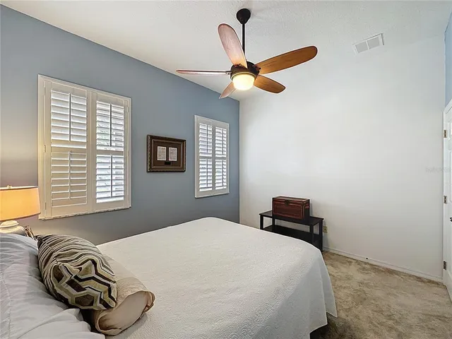a view of pool with tree in the background
