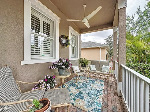 a view of a patio with table and chairs and potted plants