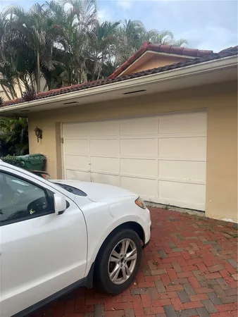 a view of a car parked in back of a house