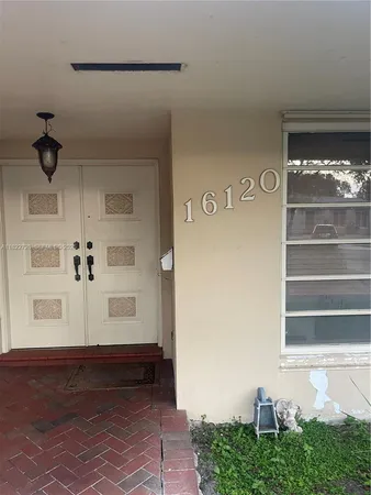 a view of front door and bedroom