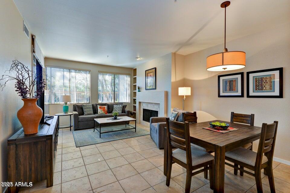 a living room with furniture a rug and a window
