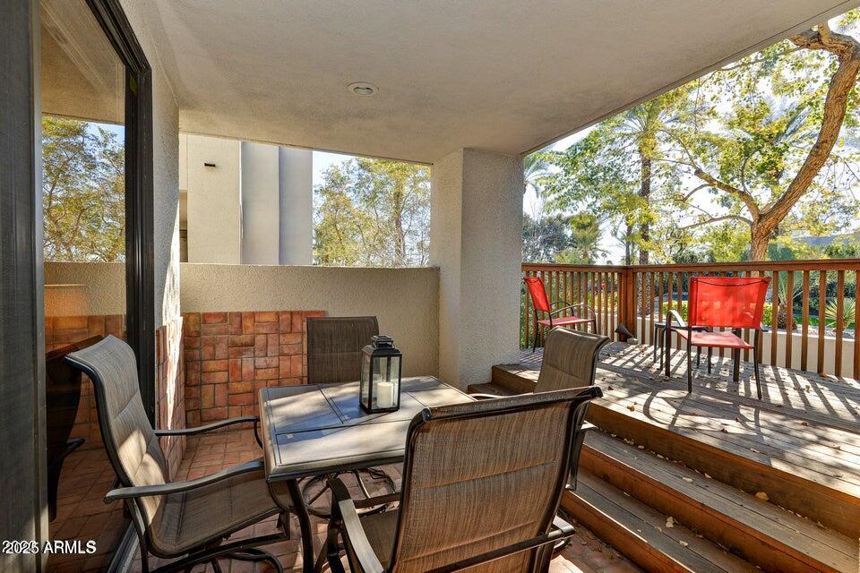 7700 East Gainey Ranch Road, Unit 104 Scottsdale, AZ 85258 - Photo 11 of 14 a outdoor dining space with furniture and outdoor view