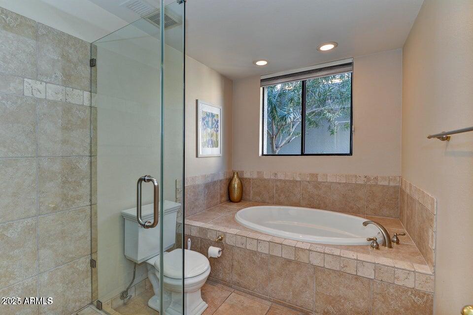 7700 East Gainey Ranch Road, Unit 104 Scottsdale, AZ 85258 - Photo 8 of 14 a bathroom with a granite countertop sink toilet and shower