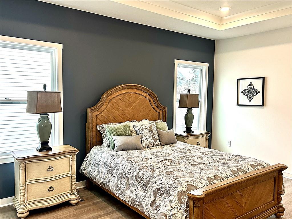 1002 Whistler Way Mars, PA 16046 - Photo 12 of 23 a bedroom with a bed and a lamp on dresser