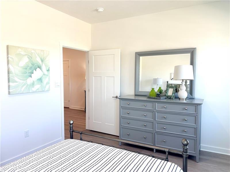 1002 Whistler Way Mars, PA 16046 - Photo 13 of 23 a bedroom with a bed and a dresser in it