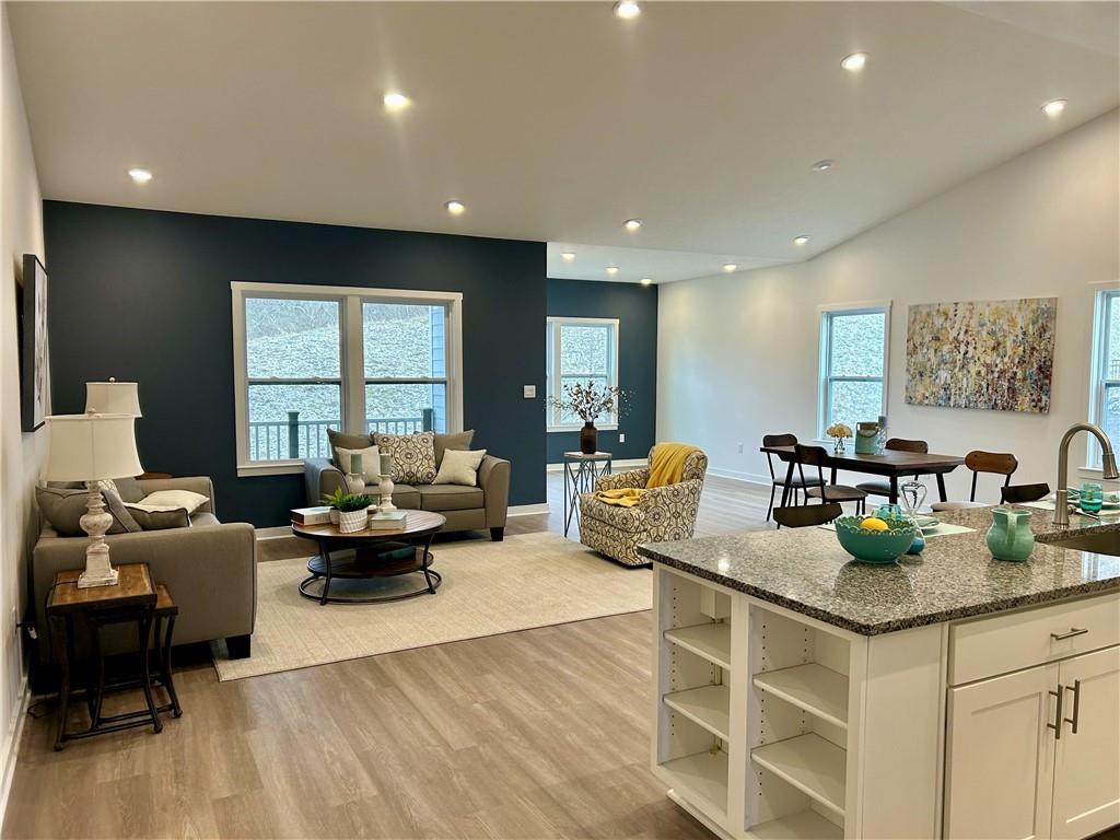 1002 Whistler Way Mars, PA 16046 - Photo 6 of 23 a living room with fireplace furniture and a wooden floor