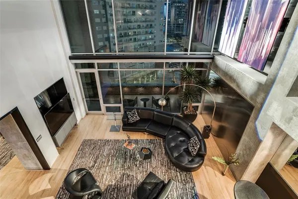 a view of living room with furniture and a flat screen tv