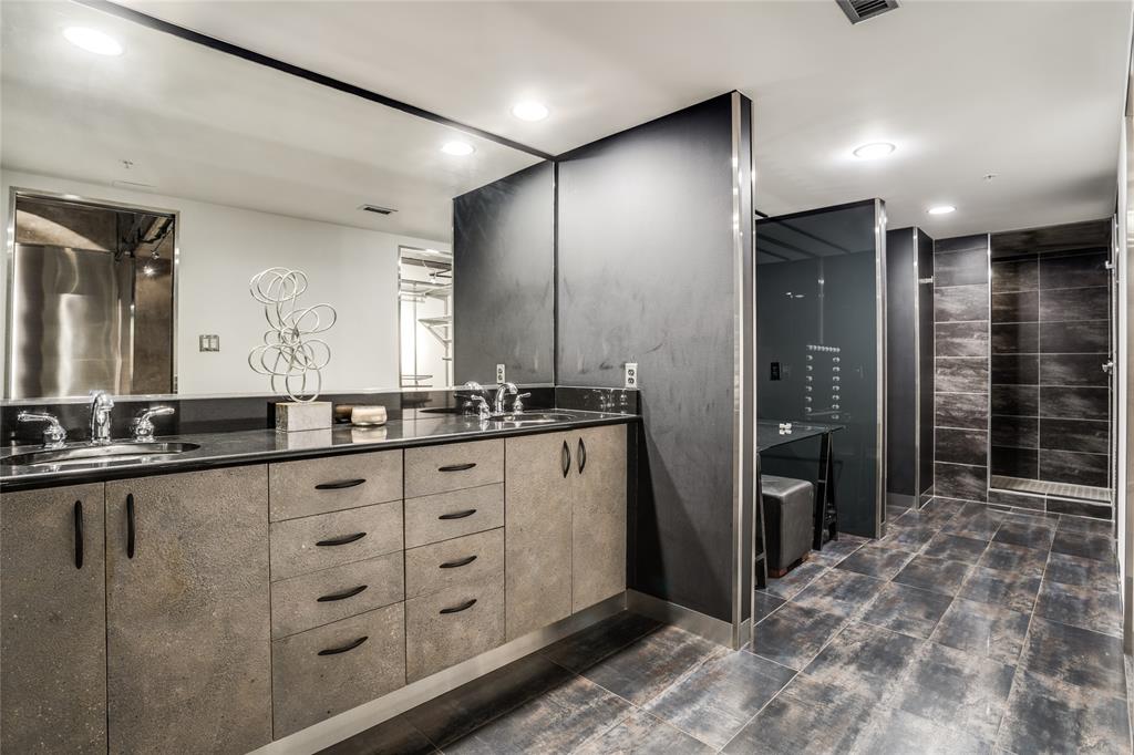 2011 Cedar Springs Road, Unit 606 Dallas, TX 75201 - Photo 23 of 33 a bathroom with double vanity and a shower