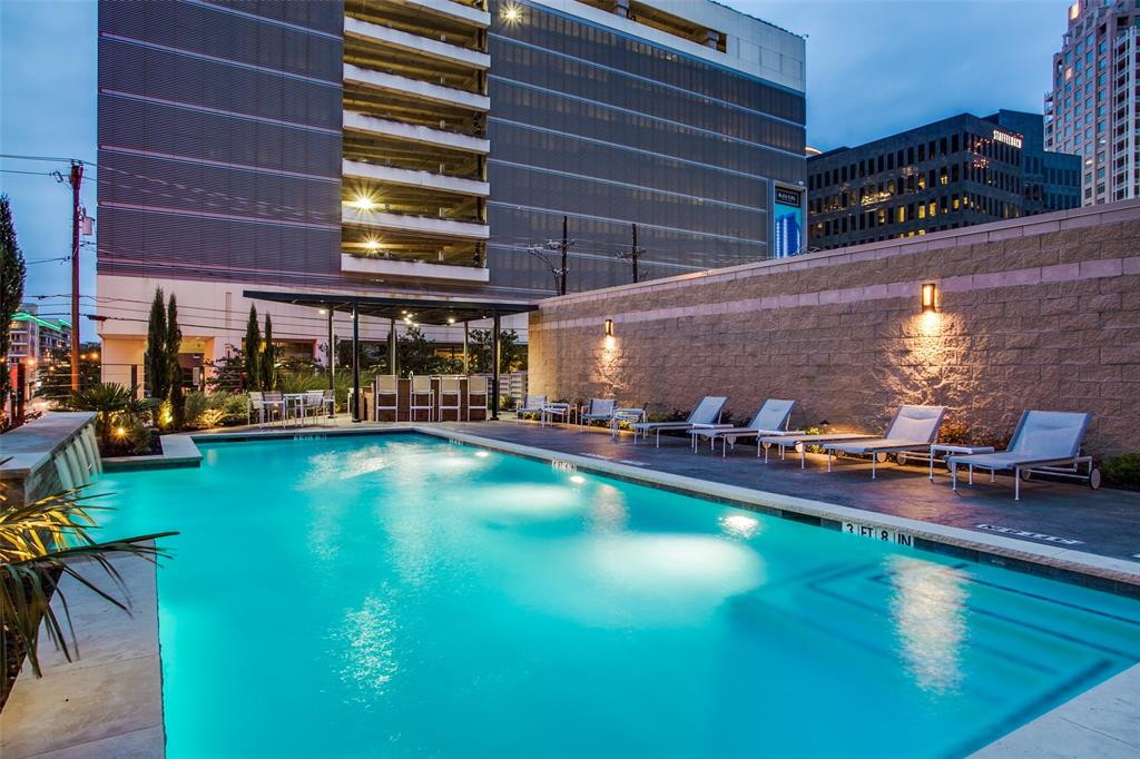 2011 Cedar Springs Road, Unit 606 Dallas, TX 75201 - Photo 29 of 33 a view of a swimming pool with outdoor seating