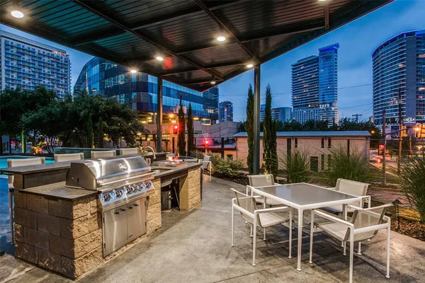 a view of a patio with a table and chairs