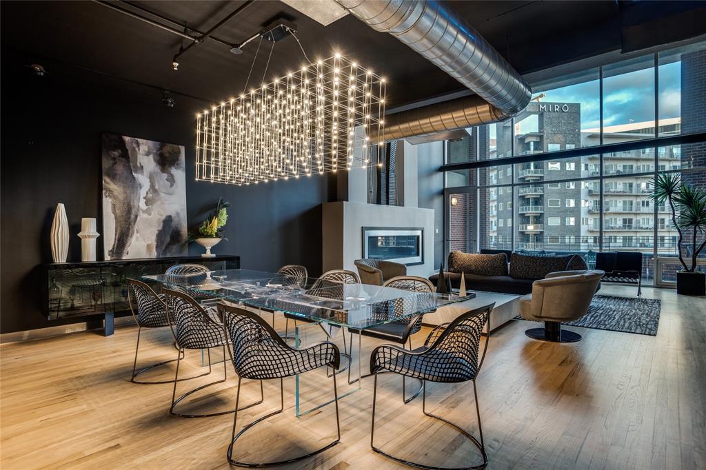 2011 Cedar Springs Road, Unit 606 Dallas, TX 75201 - Photo 6 of 33 a living room with fireplace furniture and a floor to ceiling window