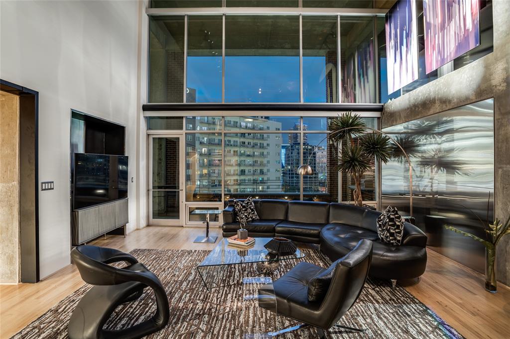 2011 Cedar Springs Road, Unit 606 Dallas, TX 75201 - Photo 8 of 33 a living room with furniture and floor to ceiling window