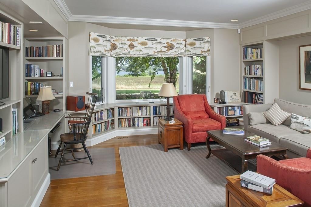 523 Barneys Joy Road Dartmouth, MA 02748 - Photo 11 of 39 a living room with furniture and a floor to ceiling window