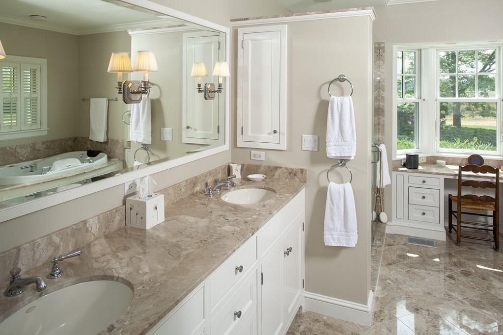 523 Barneys Joy Road Dartmouth, MA 02748 - Photo 14 of 39 a spacious bathroom with a granite countertop sink and a mirror