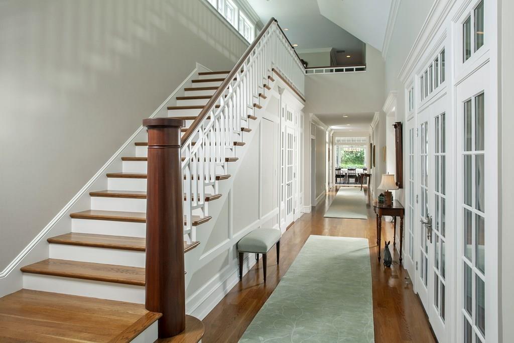 523 Barneys Joy Road Dartmouth, MA 02748 - Photo 17 of 39 a view of staircase with lots of frames on wall and a large window