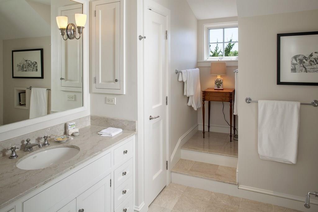 523 Barneys Joy Road Dartmouth, MA 02748 - Photo 22 of 39 a en suite bathroom with a granite countertop sink and a mirror