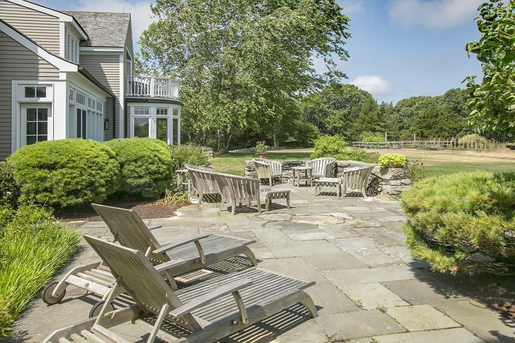 523 Barneys Joy Road Dartmouth, MA 02748 - Photo 26 of 39 a view of a patio with table and chairs and potted plants