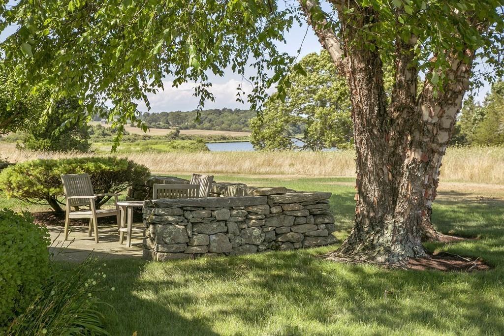 523 Barneys Joy Road Dartmouth, MA 02748 - Photo 3 of 39 a view of a garden with lawn chairs