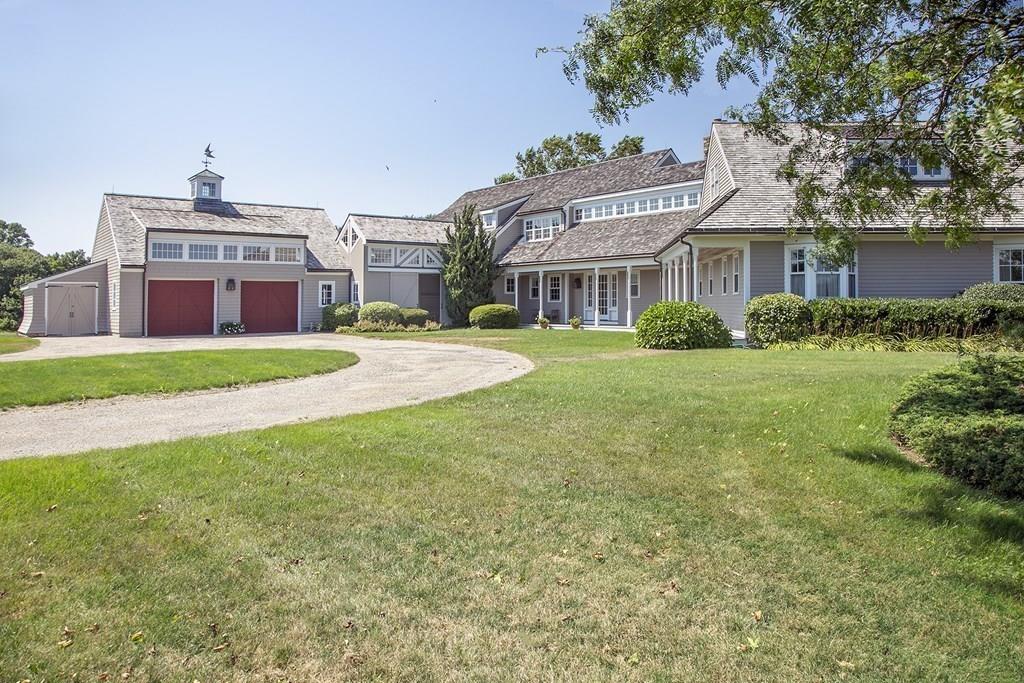 523 Barneys Joy Road Dartmouth, MA 02748 - Photo 32 of 39 a front view of a building with a garden