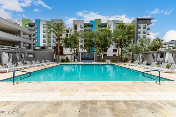 a view of a swimming pool with a patio