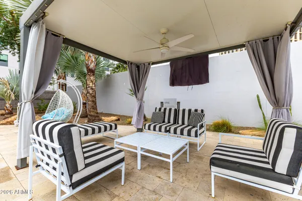 a view of living room and patio with furniture