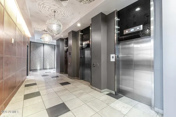 a view of a hallway with a bathroom