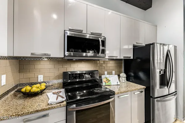 a kitchen with a stove and a microwave