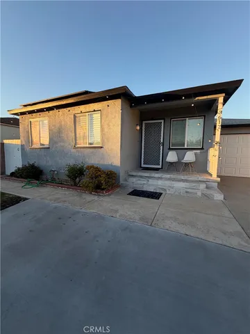 a view of backyard and car parked
