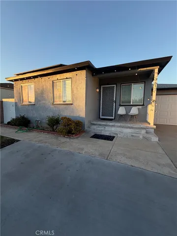 a view of backyard and car parked