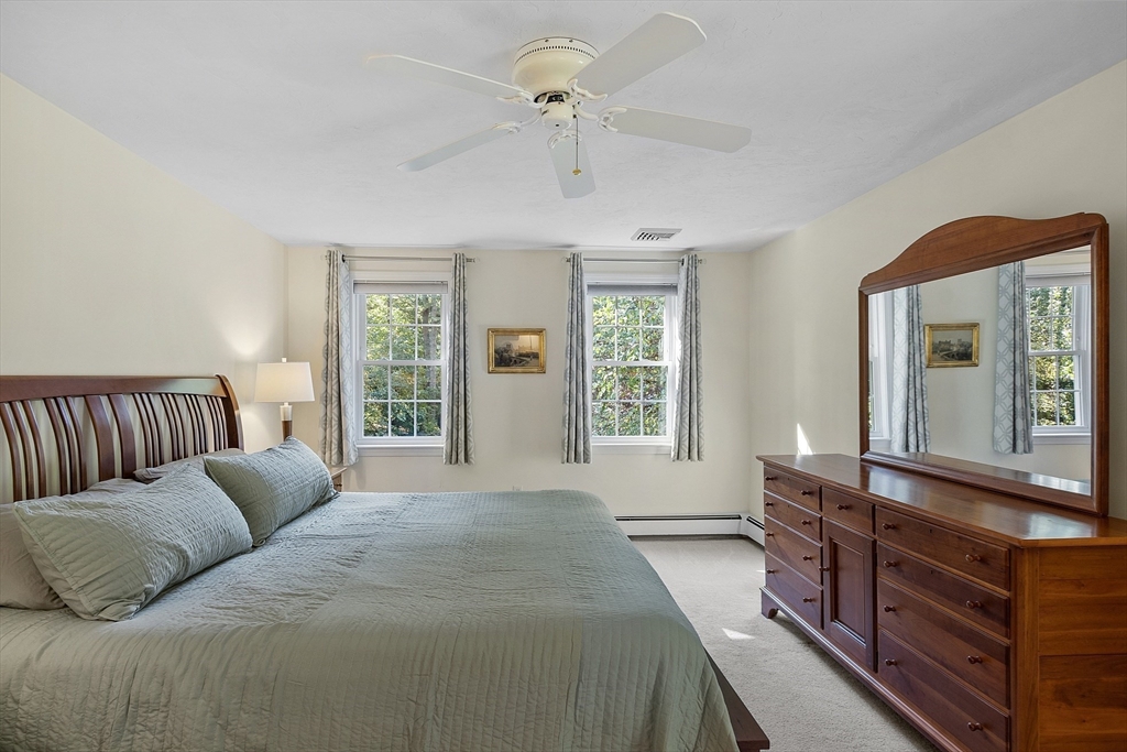 3 Brandy Hollow Littleton, MA 01460 - Photo 18 of 40 a bedroom with a large bed and windows