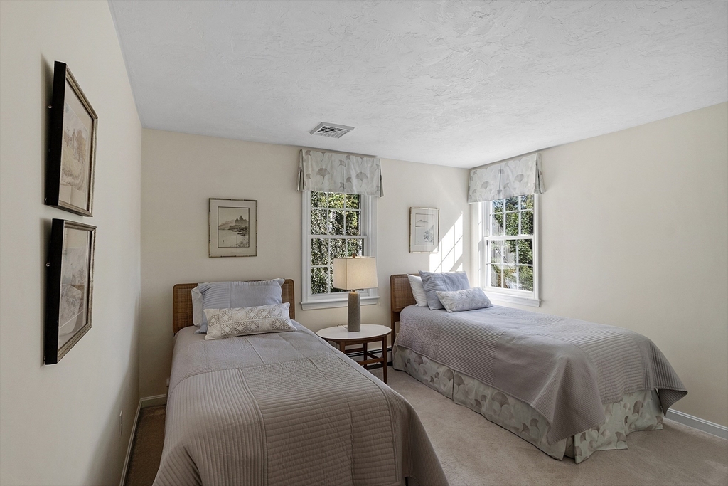 3 Brandy Hollow Littleton, MA 01460 - Photo 23 of 40 a bedroom with two beds and a large window
