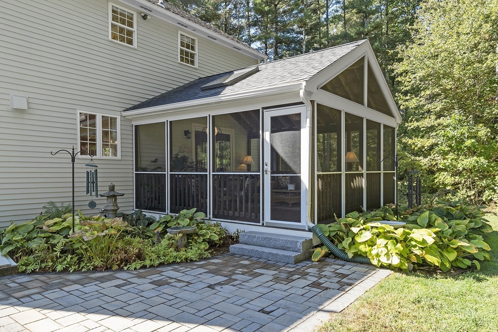 3 Brandy Hollow Littleton, MA 01460 - Photo 33 of 40 a front view of a house with a garden