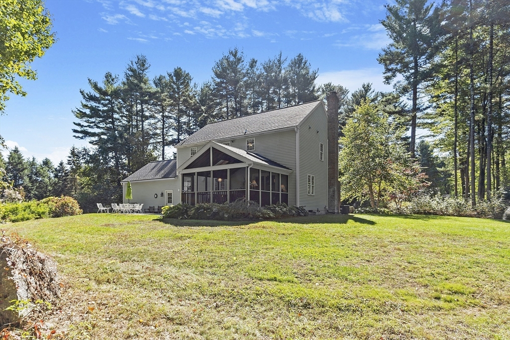 3 Brandy Hollow Littleton, MA 01460 - Photo 35 of 40 a white house with a big yard and large trees