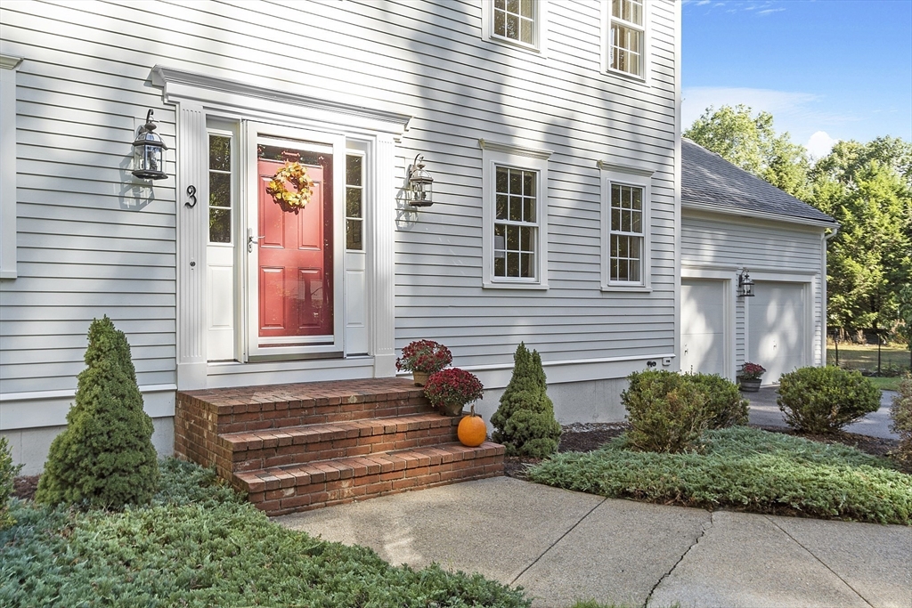 3 Brandy Hollow Littleton, MA 01460 - Photo 37 of 40 a view of a house with a small yard and a large window