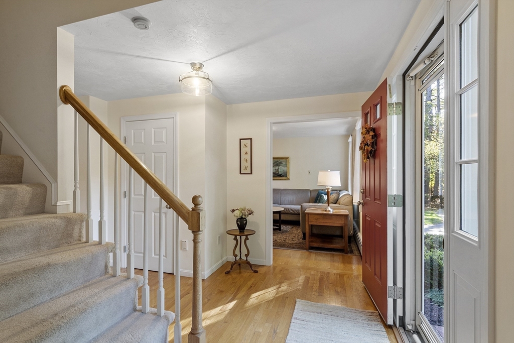 3 Brandy Hollow Littleton, MA 01460 - Photo 4 of 40 a view of a hallway with livingroom and furniture