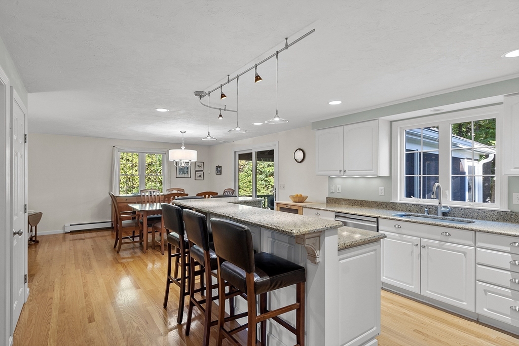 3 Brandy Hollow Littleton, MA 01460 - Photo 7 of 40 a kitchen with a table and chairs in it