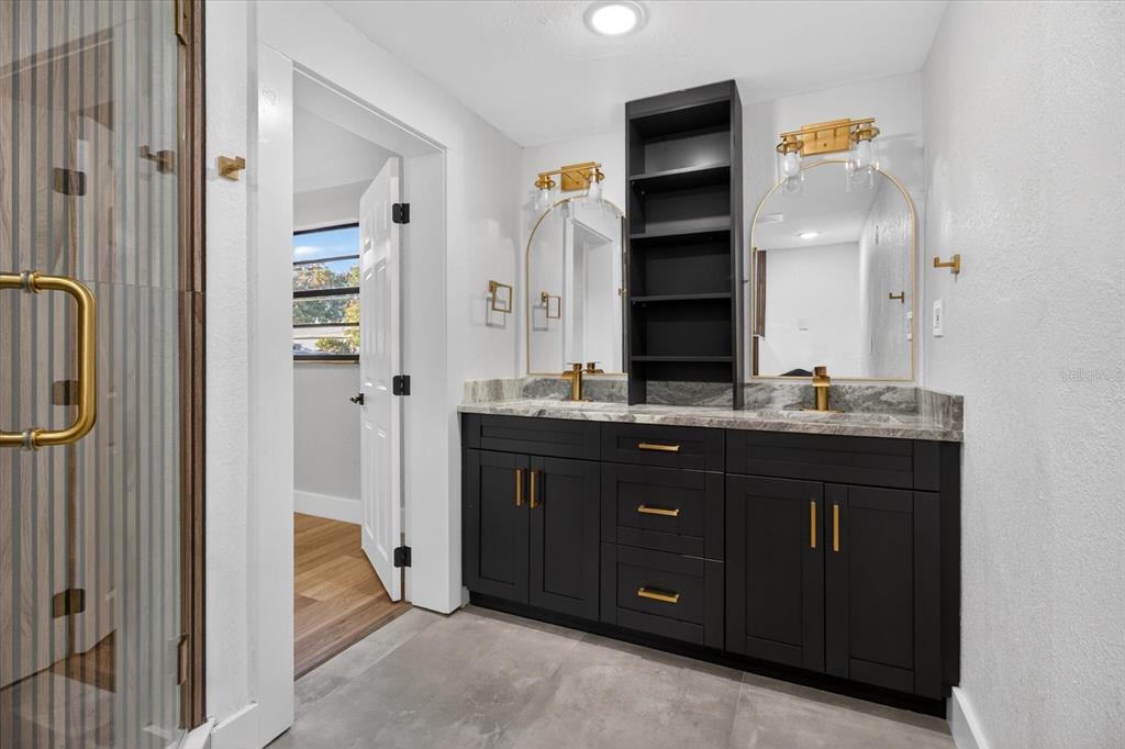 5612 Mallow Street New Port Richey, FL 34652 - Photo 24 of 43 a bathroom with a sink and a mirror