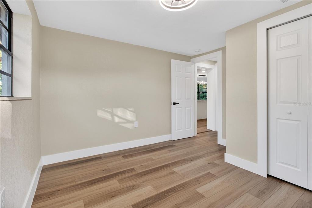 5612 Mallow Street New Port Richey, FL 34652 - Photo 27 of 43 wooden floor in an empty room