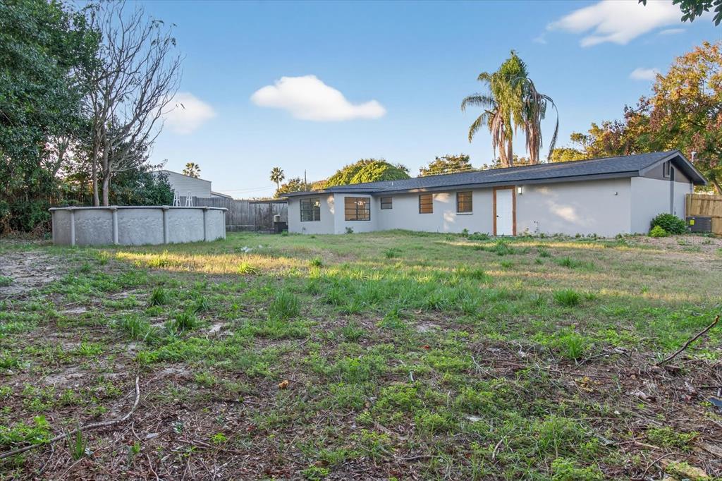 5612 Mallow Street New Port Richey, FL 34652 - Photo 37 of 43 a view of a house with a yard and plants