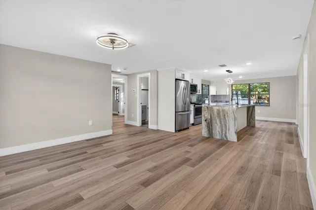 a bedroom with a bed and a potted plant