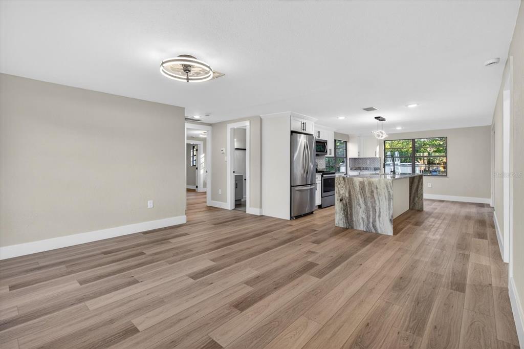 5612 Mallow Street New Port Richey, FL 34652 - Photo 5 of 43 a view of a kitchen with a wooden floor