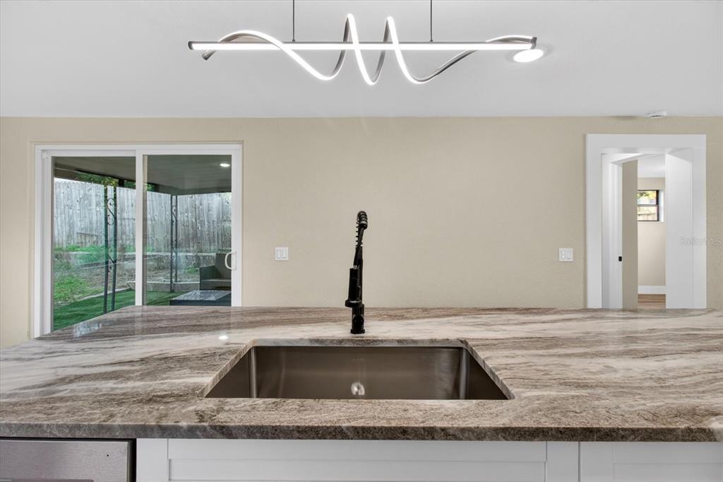 5612 Mallow Street New Port Richey, FL 34652 - Photo 10 of 43 a kitchen with a sink and a window