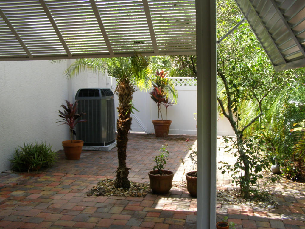 1610 Southwest Prosperity Way Palm City, FL 34990 - Photo 7 of 23 Outside paver Patio area