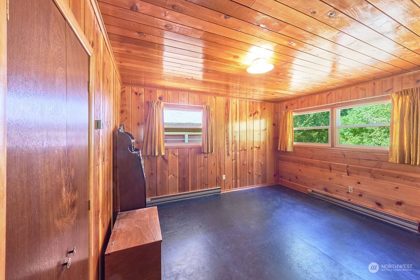 30708 Sandridge Road Ocean Park, WA 98640 - Photo 22 of 37 an empty room with wooden floor and windows