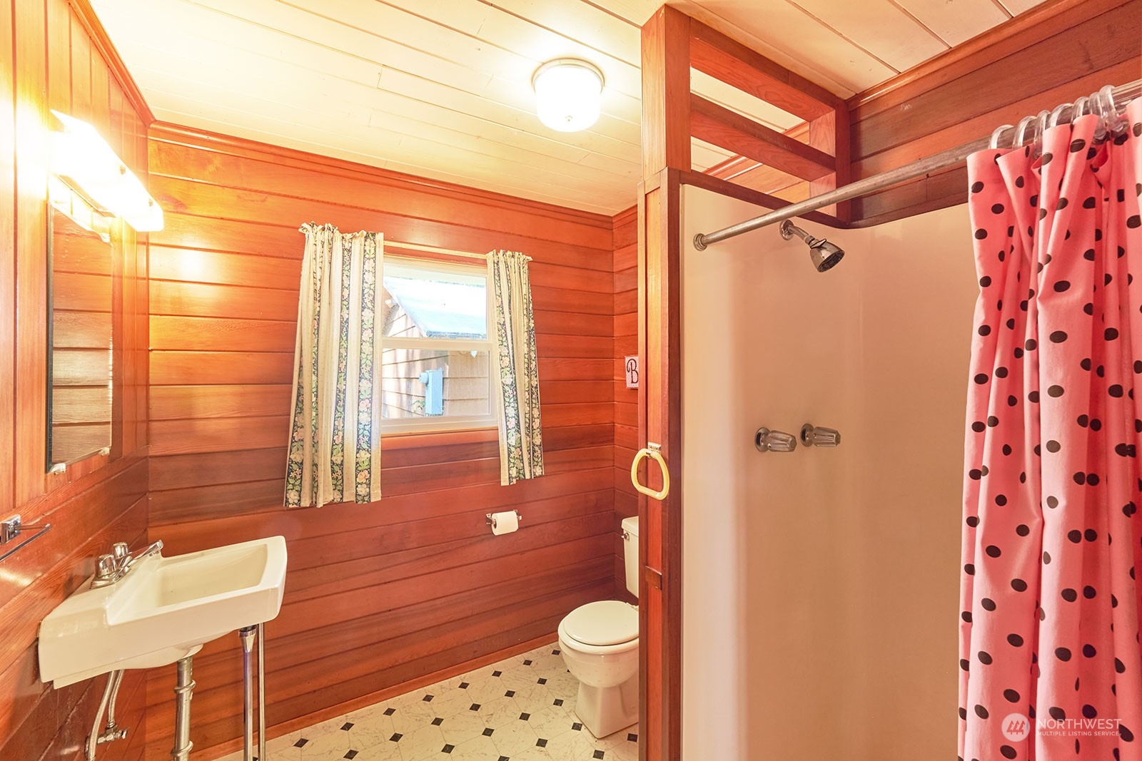 30708 Sandridge Road Ocean Park, WA 98640 - Photo 23 of 37 a bathroom with a sink and a mirror